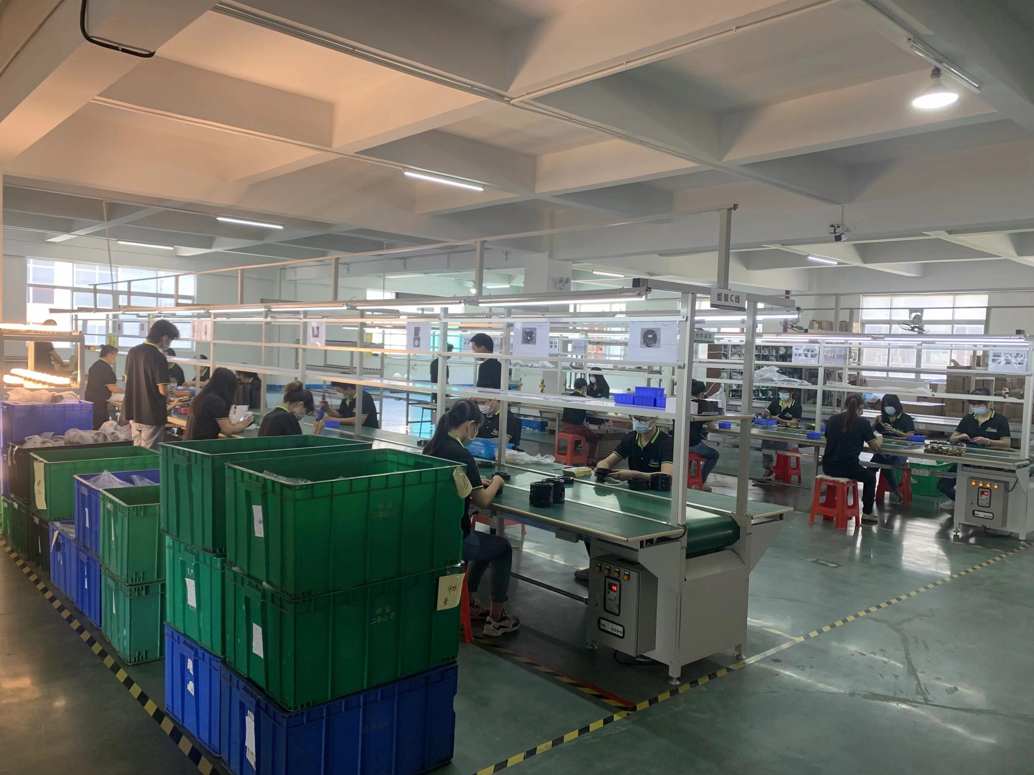 Hengen production team assembling lighting products at the workstations