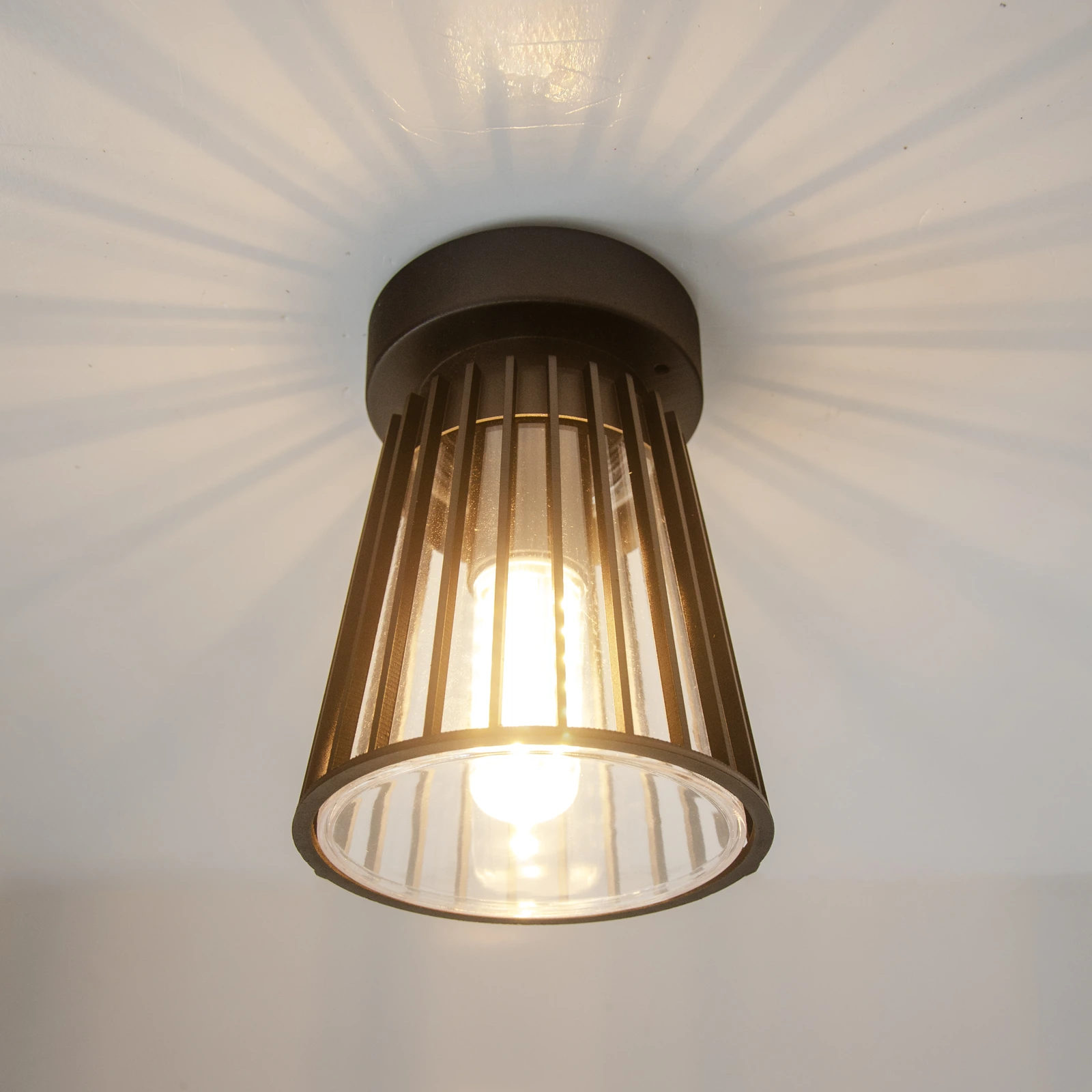 GD-PCL03-E27 · black housing · light-on view